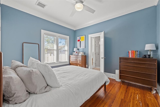 bedroom featuring wood-type flooring, ceiling fan, and crown molding