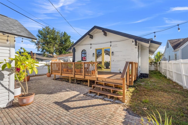 back of house featuring a deck