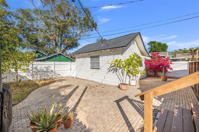 view of property exterior featuring a patio area