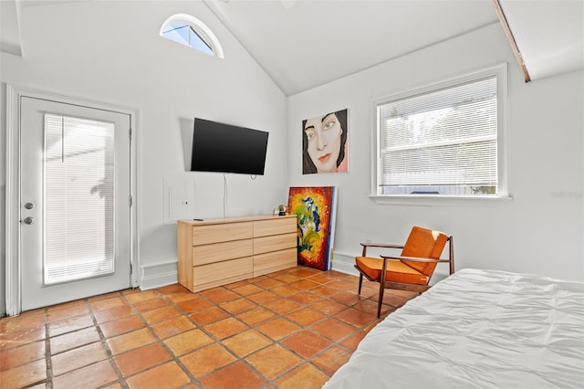 bedroom featuring high vaulted ceiling and multiple windows