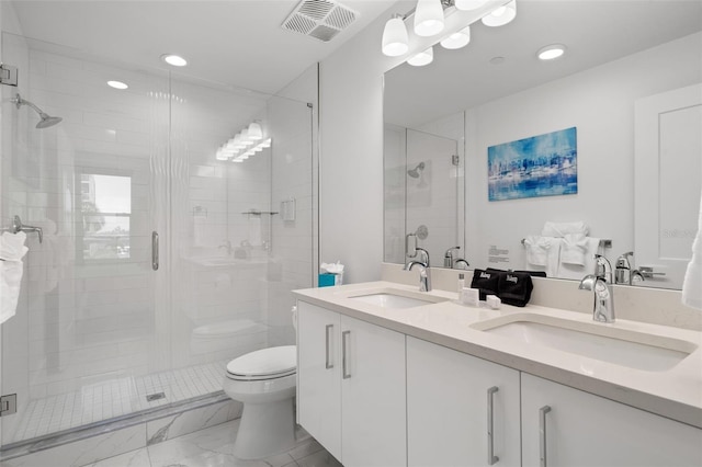 bathroom with toilet, an enclosed shower, and vanity