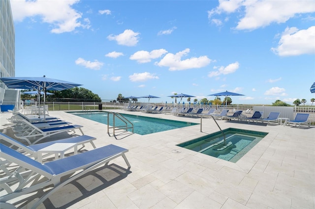 view of swimming pool with a community hot tub and a patio