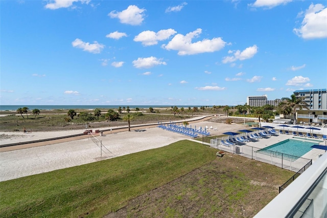 view of swimming pool featuring a water view