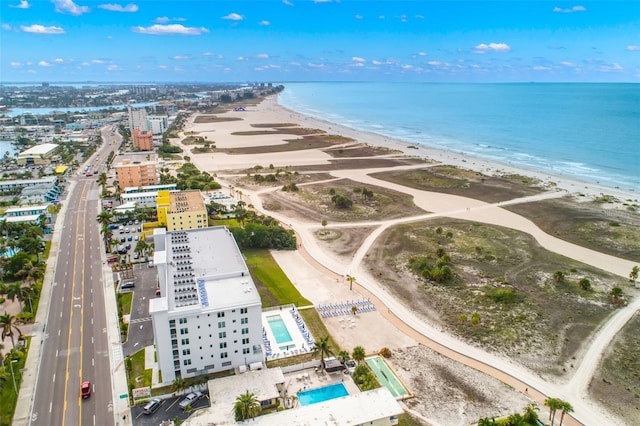 drone / aerial view with a water view and a view of the beach