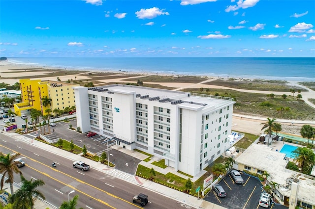 bird's eye view with a water view and a view of the beach