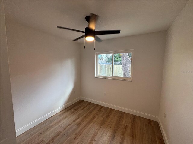 unfurnished room featuring light hardwood / wood-style floors and ceiling fan