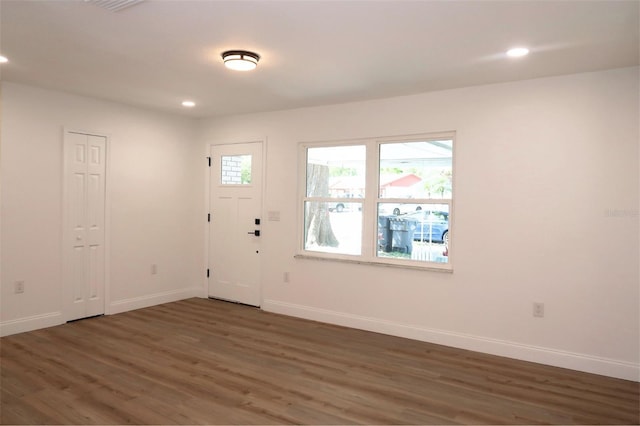 entryway with recessed lighting, baseboards, and wood finished floors