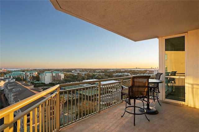 view of balcony at dusk