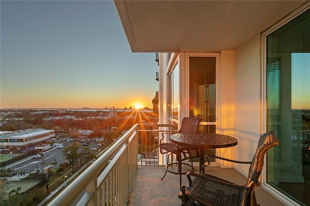 view of balcony at dusk