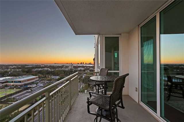 view of balcony at dusk