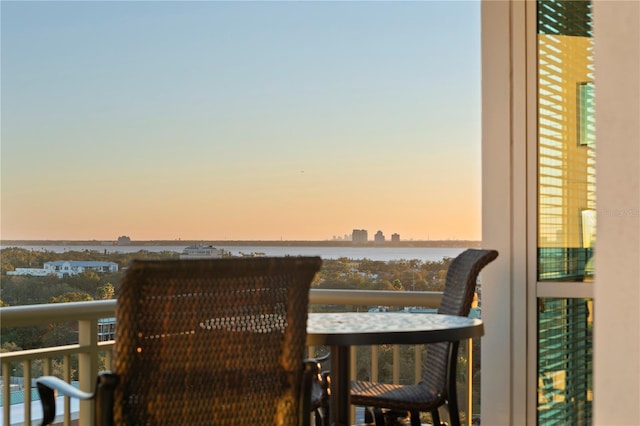 balcony at dusk with a water view