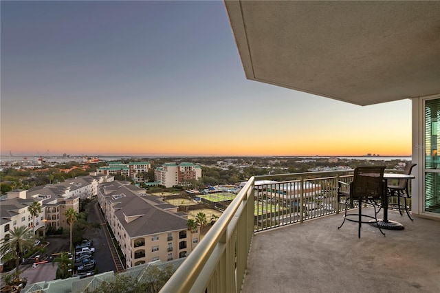 view of balcony at dusk