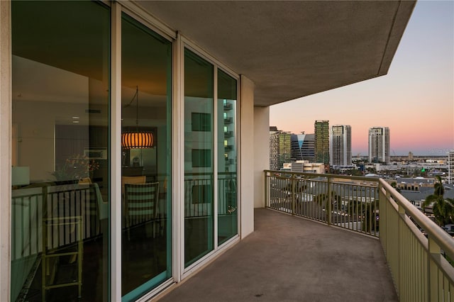 view of balcony at dusk