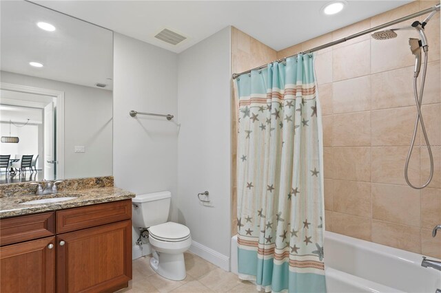 full bathroom with tile patterned flooring, shower / bath combo, toilet, and vanity