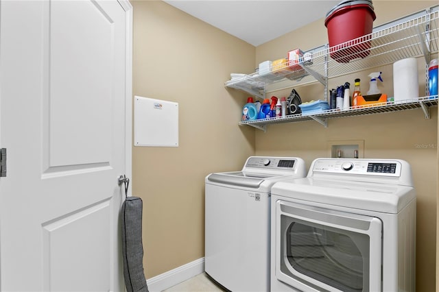 washroom with separate washer and dryer