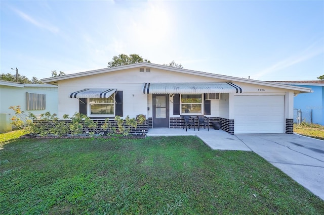 single story home with a front lawn and a garage