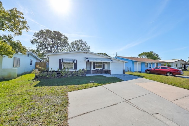 single story home with a front lawn and a garage