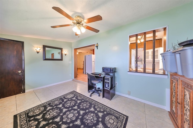 office with light tile patterned floors, a textured ceiling, and ceiling fan