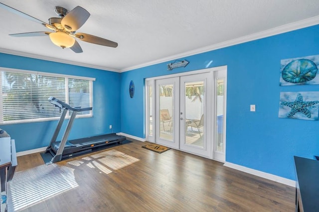 exercise area with french doors, dark wood-type flooring, ceiling fan, and ornamental molding