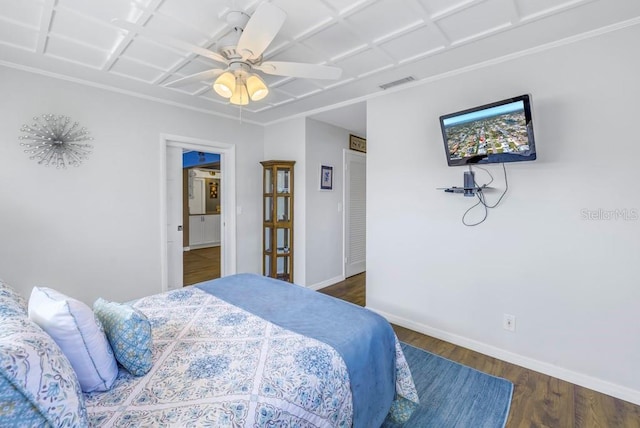 bedroom with ceiling fan and dark hardwood / wood-style floors