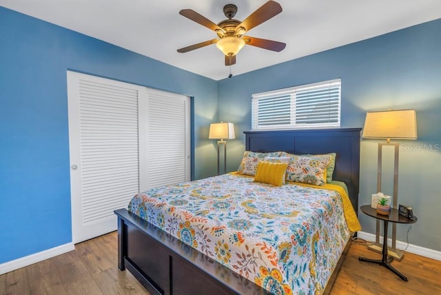 bedroom with hardwood / wood-style flooring and ceiling fan