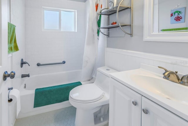 full bathroom featuring tile patterned floors, toilet, vanity, and shower / bathtub combination with curtain