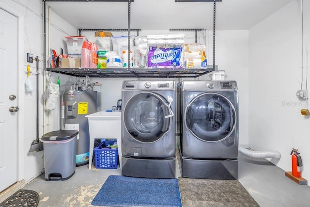 washroom featuring separate washer and dryer and electric water heater