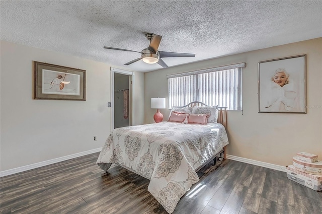 bedroom featuring a textured ceiling, dark hardwood / wood-style flooring, and ceiling fan