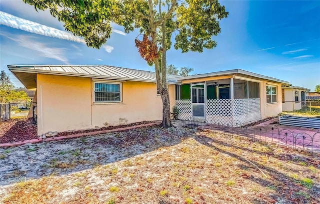 view of front of property with a sunroom