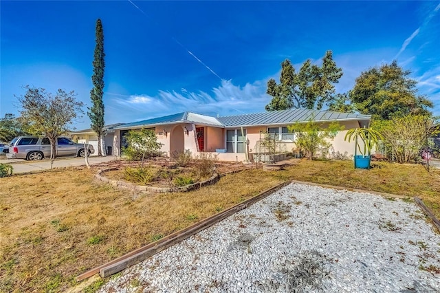 single story home with a front yard