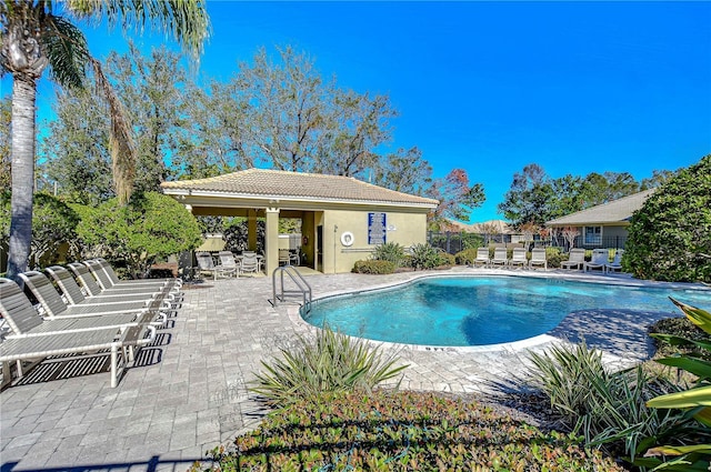 view of swimming pool featuring a patio