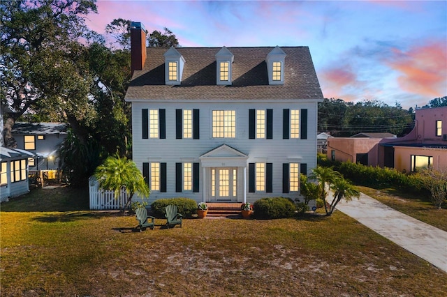 view of front of property with a lawn