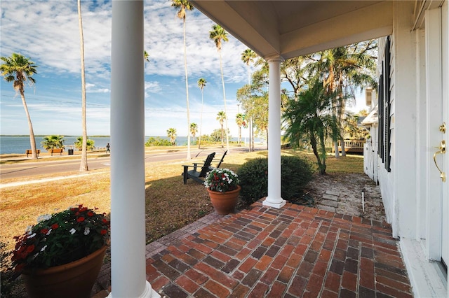 view of patio featuring a water view