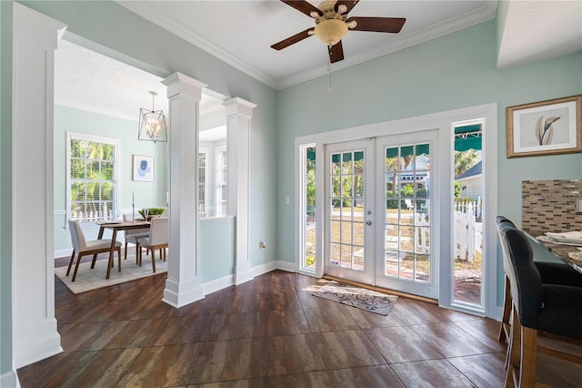 doorway with ceiling fan, ornamental molding, and french doors