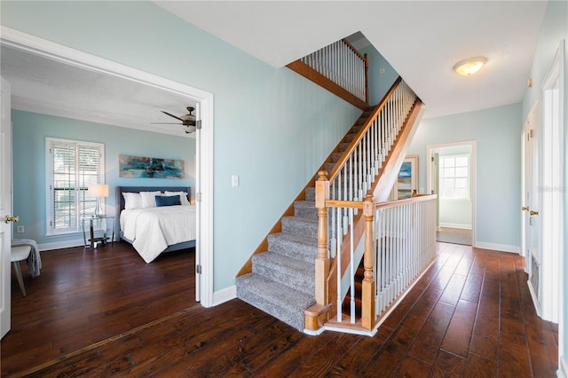 staircase featuring hardwood / wood-style flooring and ceiling fan