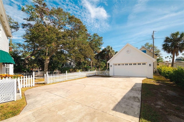 exterior space featuring an outbuilding and a garage