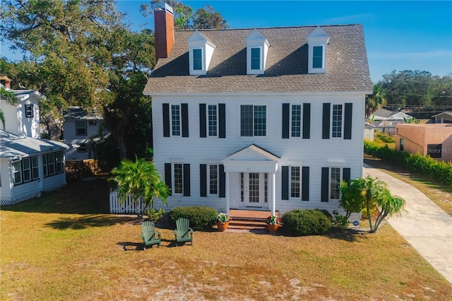 view of front of home with a front lawn