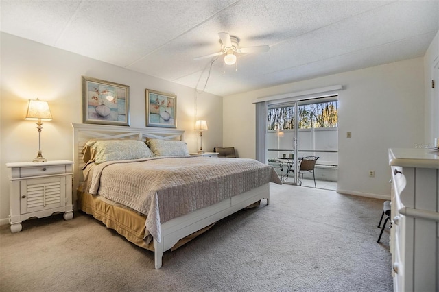 bedroom with a textured ceiling, carpet floors, and ceiling fan