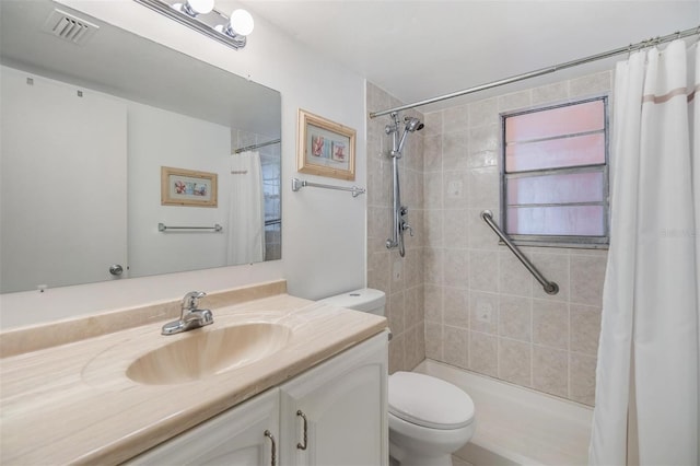 bathroom featuring a shower with shower curtain, vanity, and toilet