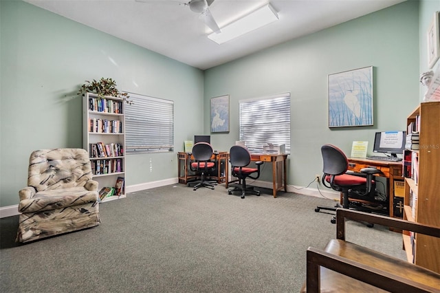 carpeted office featuring ceiling fan