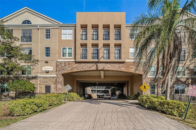 4221 W Spruce St Unit 2418, Tampa, FL 33607 - view of property featuring decorative driveway