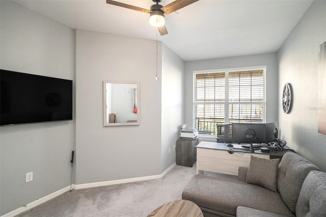 carpeted office space featuring ceiling fan and lofted ceiling