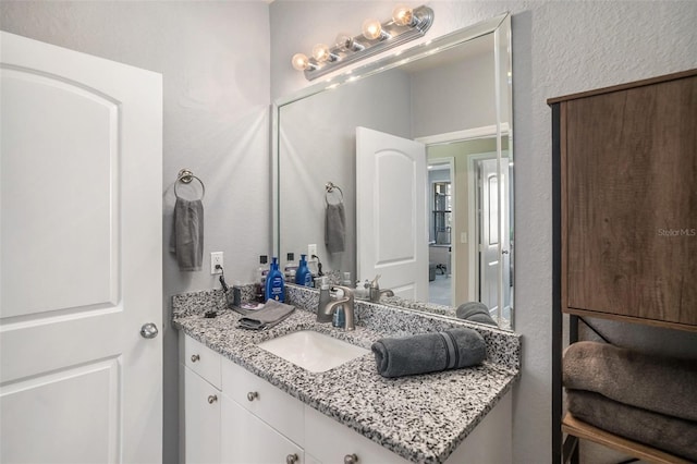 4221 W Spruce St Unit 2418, Tampa, FL 33607 - bathroom featuring vanity and a textured wall