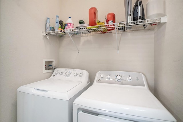 washroom with washing machine and dryer