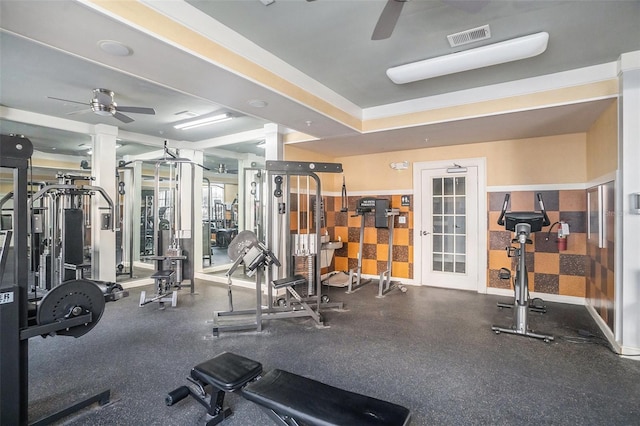 exercise room with ceiling fan