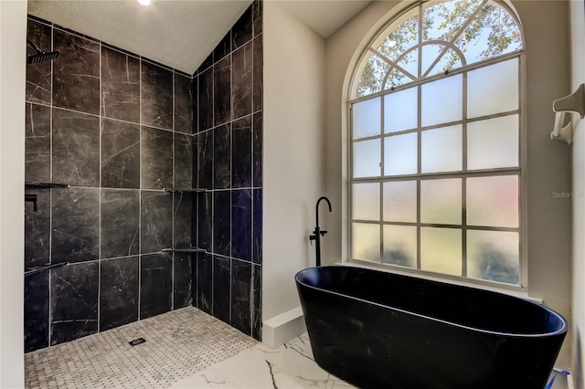 bathroom featuring a textured ceiling, independent shower and bath, and lofted ceiling