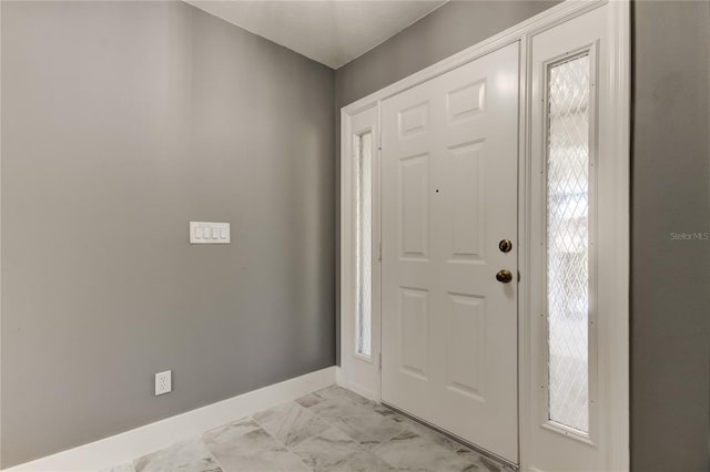 foyer entrance featuring a wealth of natural light