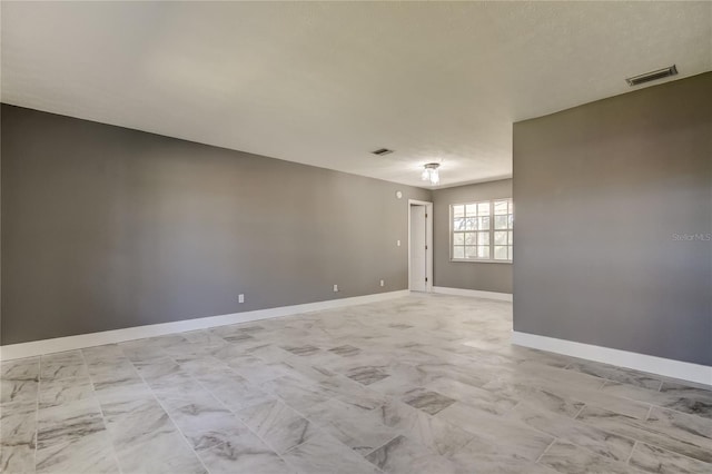 empty room with a textured ceiling