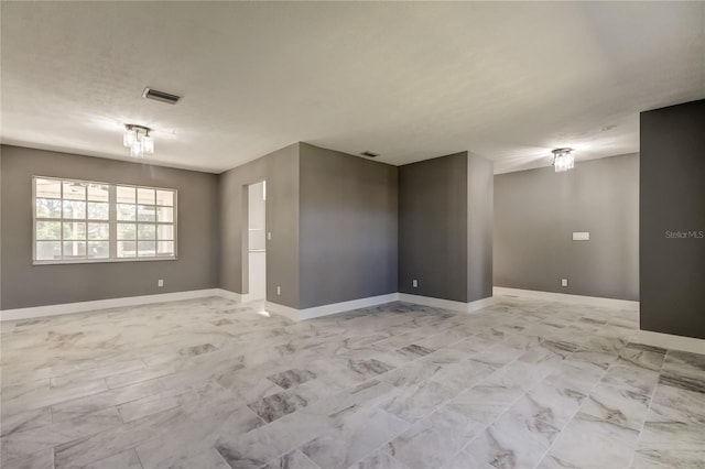 spare room featuring a textured ceiling