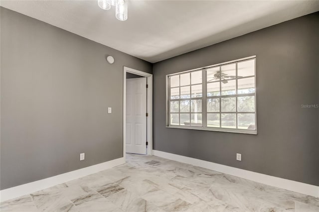 spare room with ceiling fan